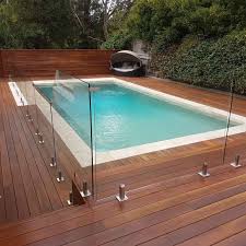 25 Amazing Wooden Deck Pool Ideas For More Comfortably And Safely Decor It S Wooden Pool Deck Decks Around Pools Pool Decks