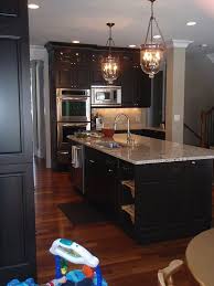 Santa cecilia light granite countertops and almost the same floor tiles are mimicking the look of dark cabinets. Countertops Kitchen Remodel Home Kitchens Espresso Cabinets