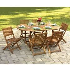 The Gateleg Patio Table And Stowable Chairs Hammacher Schlemmer Patio Table Patio Table Set Round Patio Table