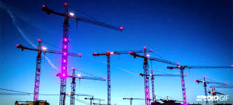 watch construction cranes come to life and dance in a fun light show light show construction crane