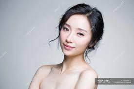Maybe you would like to learn more about one of these? Portrait Of Beautiful Chinese Woman With Natural Makeup Sensual Smile Stock Photo 184809012