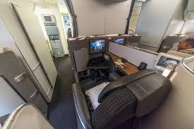 It is the earlier model with very narrow seating in economy, and only basic recliners in business and first class: American Airlines First Class Review Dfw Hkg 777 300er