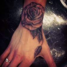 Rose Tattoo On Wrist Hand Www Cashandglory Nl Amsterdam Based Tattoo And Piercing Shop Rose Tattoos On Wrist Piercing Shop Tattoos