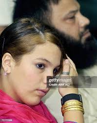 British teenager Molly Campbell gestures as she sits alongside her... News  Photo