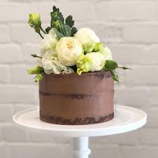 Use the rest of your sixlets to dress up the sides of your cake. Julie Floral Chocolate Semi Naked Cake Burnt Butter Cakes
