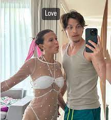 Millie Bobby Brown Looks Angelic in a White Bikini with a Sheer Pearl Cover  Up