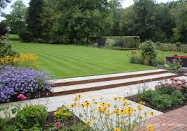 In this medium garden design, we've gone for a wonderful white slatted dividing wall with a large design mirrored water feature. Garden Design Large Garden Lawn Cart