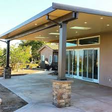 Insulated Aluminum Patio Cover With Skylights Led Recessed Lighting And Stone Wrapped Colum Covered Patio Design Aluminum Patio Covers Backyard Covered Patios