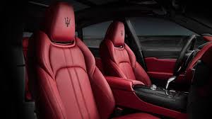 Comfort Reigns In The Distinctly Racy Yet Roomy Cabin Maserati Suv Red Interior Car Maserati Interior