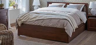 A queen size bed frame made from three benches, each with two large drawers. Best Ikea Storage Beds 2021 Ranks Buy Or Avoid