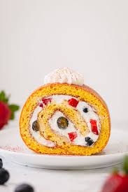 Place a clean sheet of parchment paper over the back of cake and roll cake up in towel carefully (from short end to short end). How To Make A Roll Cake Sweet Savory