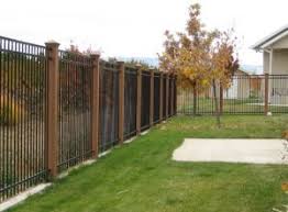 Unassembled fast and easy to assemble no welding required. Black Metal Fence With Wood Posts Fence Landscaping Backyard Fences Fence Design
