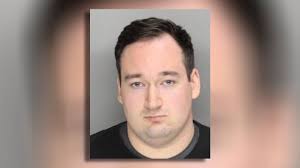 Former officer accused of killing 20-year-old during chase turns himself  into police