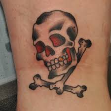 The crossbones, with a skull above them, began as a symbol of death and mortality on tombstones in. Traditional Skull And Crossbones Tattoo A Photo On Flickriver