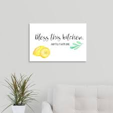 This is a framed print of country kitchen items with the saying, bless the food before us, those beside us, the love between us. tin coffee pot and vintage glass bottles and a candle burning low on a wooden shelf leave you feeling the coziness of a farm kitchen. Bless This Kitchen Canvas Wall Art