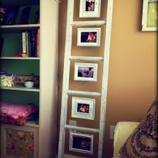 Ladder With Hanging Picture Frames On Each Step Love Look Familiar Jamie Rustic Chic Living Room Home Decor Decor