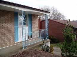 A custom wrought iron railing can beautifully accent a straight or curved staircase. Mcm Ranch Keep Exterior Wrought Iron Columns Or Replace