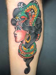 A snake tattoo can symbolize many things from fertility to eternity. Traditional Woman With Snake Tattoo By Trevor Taylor Liberty Tattoo Seattle Tattoos