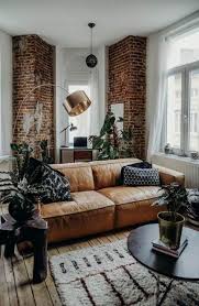 Remember, brown and structured isn't the only way to do it. I Chose This As A Symmetrical Example Primarily Because Of The Brick Beams That Give A Symme Leather Couches Living Room Couches Living Room Rustic Living Room