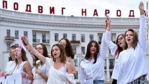Women with old belarusian national flags march during an opposition rally to protest the election results in minsk, belarus belarusian policemen drag and detain a participant of the women's march. Belarus Authorities Arrest Thousands Following Disputed Presidential Election Cnn