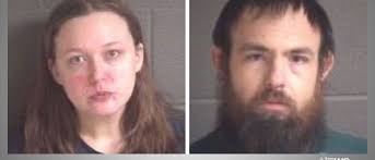 Buncombe County couple charged with abusing adopted child