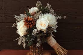 Try looking into bouquets made entirely of bare branches or sprigs of pine or evergreen for a very seasonal bouquet alternative. Rustic Winter White Wedding Bouquet Winter Wedding Bouquet Winter Brides Bouquet Woodla Winter Wedding Flowers White Wedding Bouquets Winter Wedding Bouquet