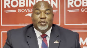 Betty Wallace slides past Oak Island incumbent