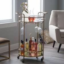 Add style and class to any dining room or office with this gold grade walnut bar cart with flat black hardware. 10 Bar Carts For The Perfect Cocktail Setup Round Bar Cart Bar Cart Decor Gold Bar Cart
