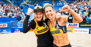 Laura ludwig hugs team mate sara goller of germany after winning a point during the women's beach volleyball preliminary match between brazil and germany on day 4 at horse guards parade on july 31. Laura Ludwigs Signiertes Trikot Von Der Beachvolleyball Wm