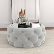 Get 5% in rewards with club o! Clio Round Storage Coffee Table In Grey Linen With Mirrored Top Furniture123