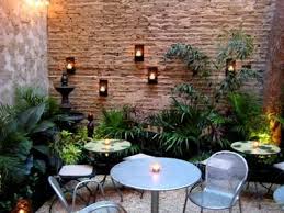 Small Courtyard Design With Wall Mounted Candles Great Little Patio Space Courtyard Gardens Design Small Courtyard Gardens Small Patio Design