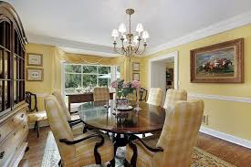 These sheer white patterned curtains look great against the sunny yellow walls in this eclectic dining room design. 30 Yellow Dining Room Ideas Photos Home Stratosphere