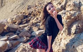 Paired with skinny jeans, boots, and a knit hat, this style can take you from the first snowfall all the way to the first signs of spring. Hd Wallpaper Mila Azul Rocks Looking At Viewer Skirt Black Sweater Smiling Wallpaper Flare