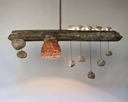 The unique three bulb wood pendant lamp is made witth roots of a maple wood. Driftwood Light With Quartz Pebble Pendants Modern Designer Etsy Rustic Ceiling Lights Driftwood Lamp Wooden Chandelier