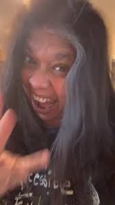 Tuesday Thoughts:Optimism , We must remain optimistic.There is no other  choice. , [image description: brown skinned woman with dark brown hair,  wearing a black T-shirt, with a white graphic of hands, ...