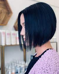 A pop of dark blue hair color on a short haircut is a colorful contrast to a dark mustache and medium light skin tone. Dark Blue Hair How To Get This Darker Hair Color In 2021