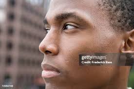 Closeup Of Young Man Looking Away High-Res Stock Photo