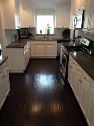 Kitchen With Grey Wood Floors And Brown Wood Floors Dark Brown Kitchen Cabinets Wood Floor Kitchen Kitchen Flooring