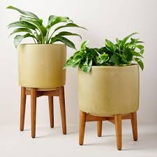 Check out our mid century planter selection for the very best in unique or custom, handmade pieces from our planters & pots shops. Mid Century Turned Wood Leg Planters Yellow Crackle