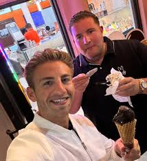 No, I'm not wearing lipstick. That's dark chocolate gelato all over my lips  like a six-year-old. And that's my friend Marco who was smart enough to get  a cup and a spoon.