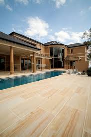 The stone is naturally smooth and durable, with patterns of brown, gold and cream forming throughout the stone with stunning variation whilst maintaining an overall unified appearance. Teakwood Sandstone Pavers Traditional Pool Sydney By Cinajus Houzz Au
