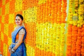 Wall Decoration With Marigolds At Home During Wedding Flower Decorations Home Flower Arrangements Flower Wall Decor