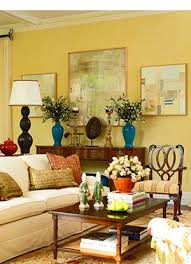 Living Room With Sunny Yellow Walls And Brightly Hued Accents Yellow Walls In Living Room Yellow Decor Living Room Yellow Walls Living Room Yellow Home Decor
