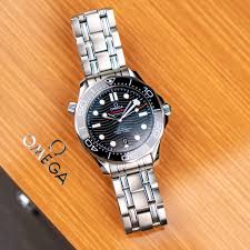 This watch is in great condition, fits a smaller wrist but can add links or change band if need be. Omega Seamaster Diver 300m Black Dial Watch Trading Co
