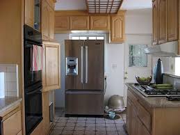 Due to the timber frame construction, we had to drywall the ceiling to obtain recessed lighting and an overall brighter kitchen. Before And After 70s Kitchen Makeover