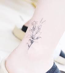 117 Of The Very Best Flower Tattoos Tattoo Insider Lily Tattoo Design Lily Flower Tattoos Tattoos