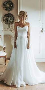30 Simple Wedding Dresses For Elegant Brides Simple Wedding Dress Strapless Silk Wedding Dress Wedding Dress Guide