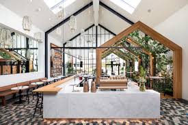 Boutique Coffee Roaster Coperaco S First Cafe Holds A Modern Tree House Modern Tree House Coffee Shops Interior Cafe Interior Design