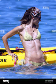Wearing a tiny yellow bikini, Victorias Secret Angel Alessandra Ambrosio,  husband Jamie Mazur and their daughter Anja Louise spend a day at the  beach. The group posed for photos and went for