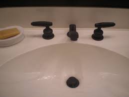 I want to spray paint my bathroom counter top and sink (all one piece). Can You Spray Paint Bathroom Faucets Oh Yes You Can The Style Sisters